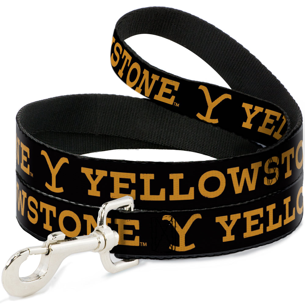Close-up of the weathered black and orange Yellowstone logo on the dog leash