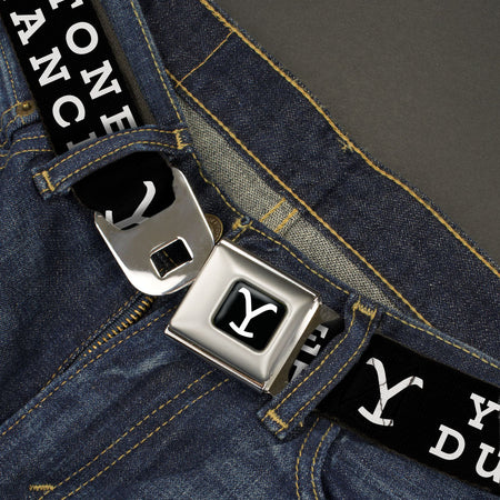 Close-up of the authentic push-button seatbelt buckle with Yellowstone logo