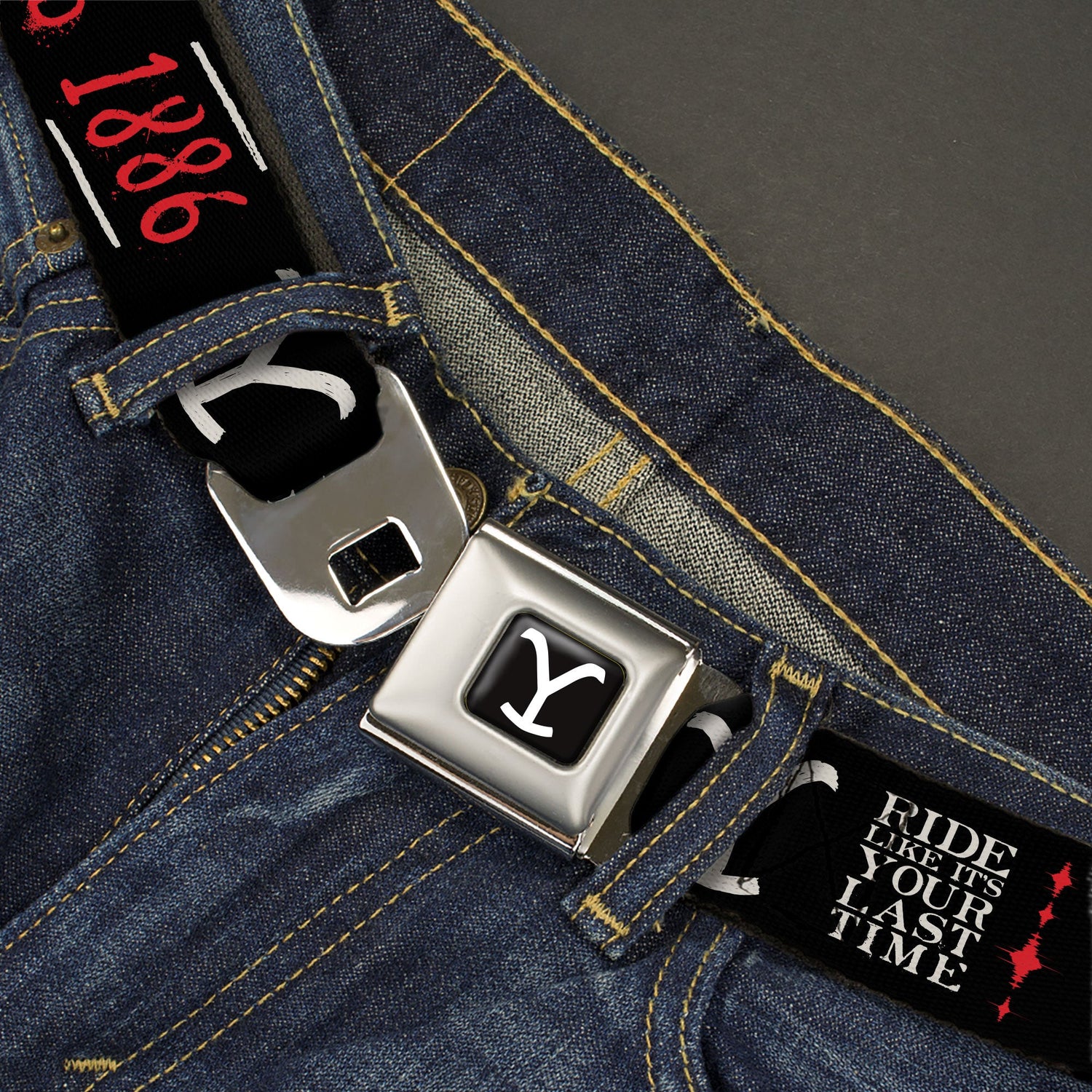 Close up of the metal seatbelt style buckle on the Yellowstone belt