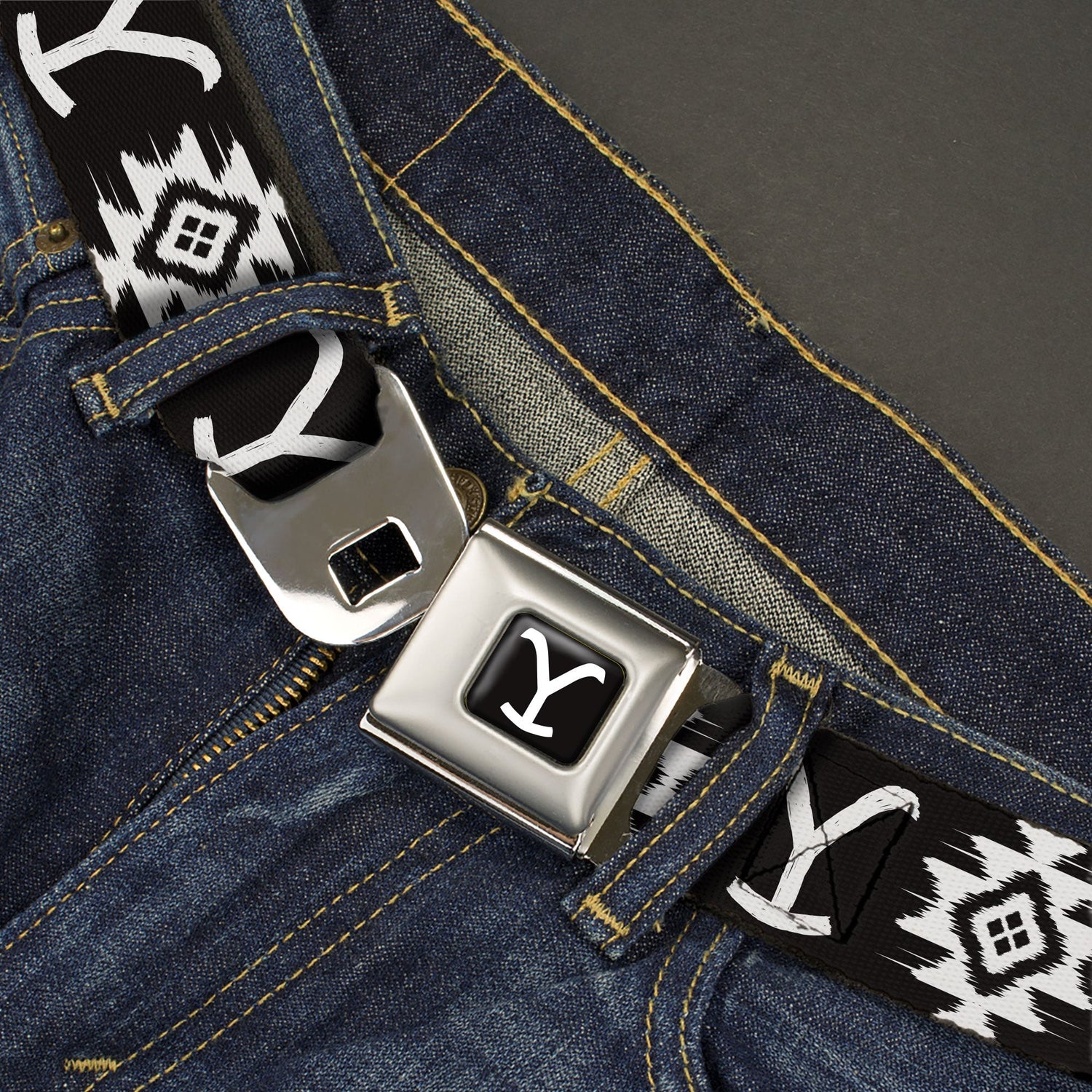 Close up of the authentic seatbelt buckle release with Y logo