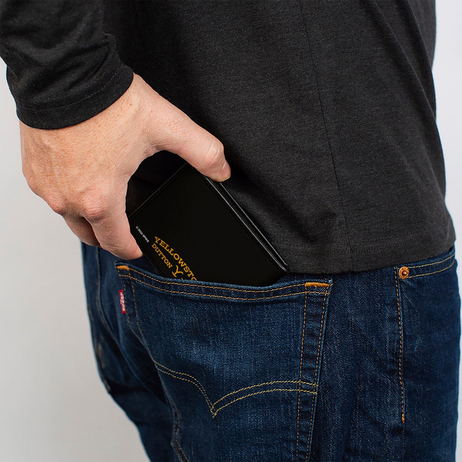 Side profile of slim Yellowstone bi-fold wallet showing thickness