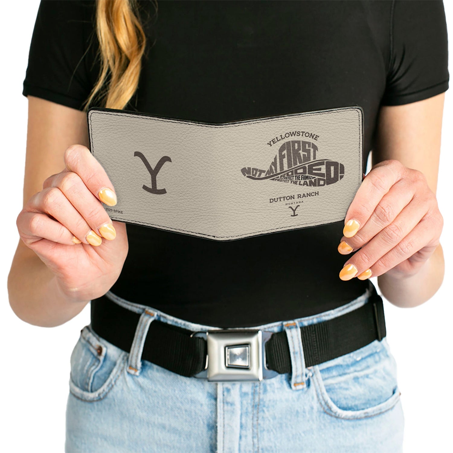Wallet being held to demonstrate scale and size