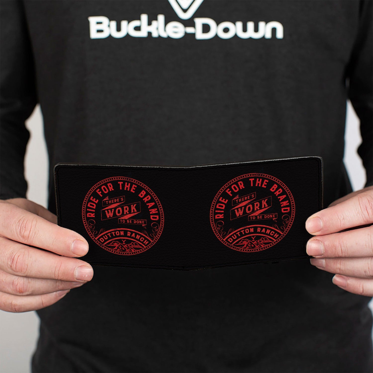 Close-up of the red Dutton Ranch Y logo on the black vegan leather.
